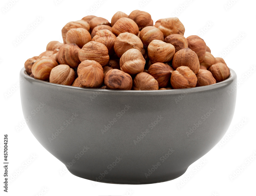 Peeled hazelnuts in a bowl isolated on white, side view. Template for designers Peeled hazelnuts in a bowl isolated on white, side view. Template for designers