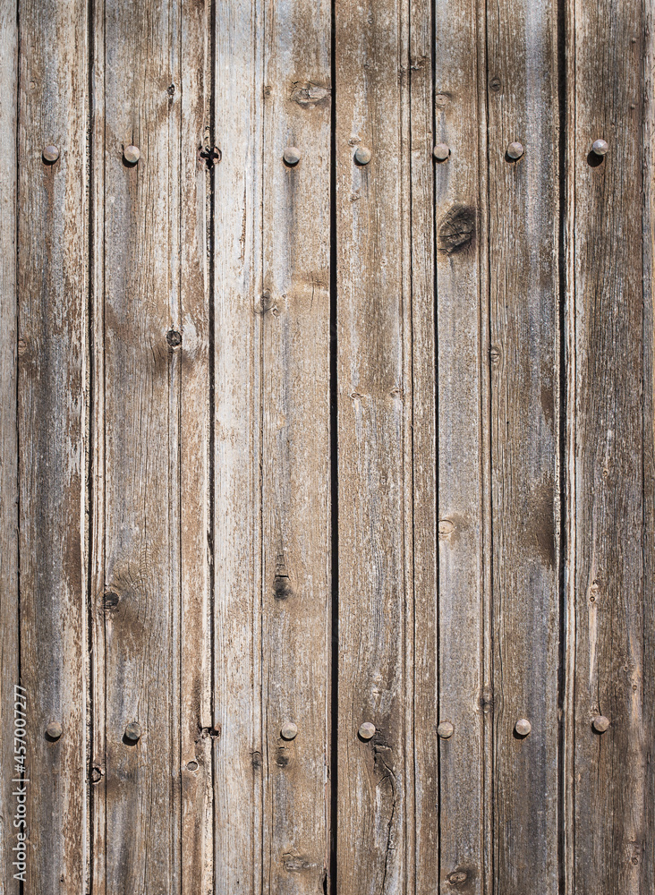 Naklejka premium Weathered wooden background. Old ancient wooden texture.