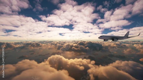 Dramatic scene of an airplane flying from side to side over clouds and ocean with beautiful sunset in the horizon. Aerial view of a commercial plane in flight over the sea.