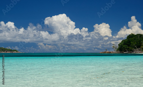Beautiful beach of Seychelles with a blue and cloudy tropical sky - Curieuse island
