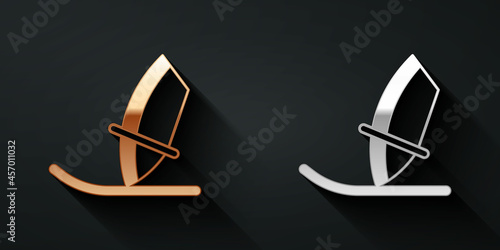Gold and silver Windsurfing icon isolated on black background. Long shadow style. Vector