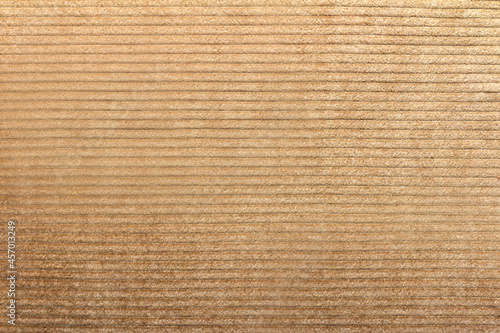 Texture backdrop photo of beige colored corduroy fabric cloth. photo