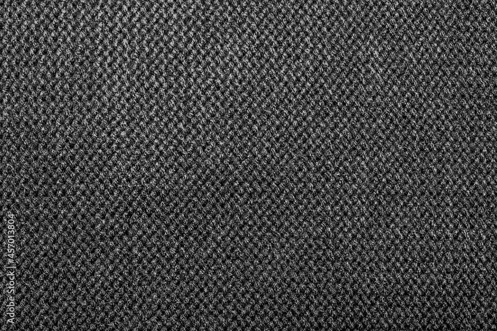 Texture backdrop photo of grey colored knitted fabric cloth. Texture backdrop photo of grey colored knitted fabric cloth.