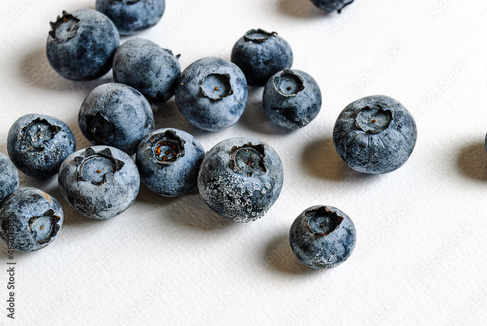 a lot of blueberries on a white background a lot of blueberries on a white background