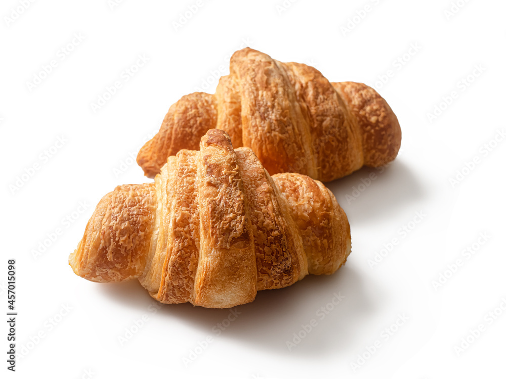 Traditional French croissants made of puff pastry on a white background