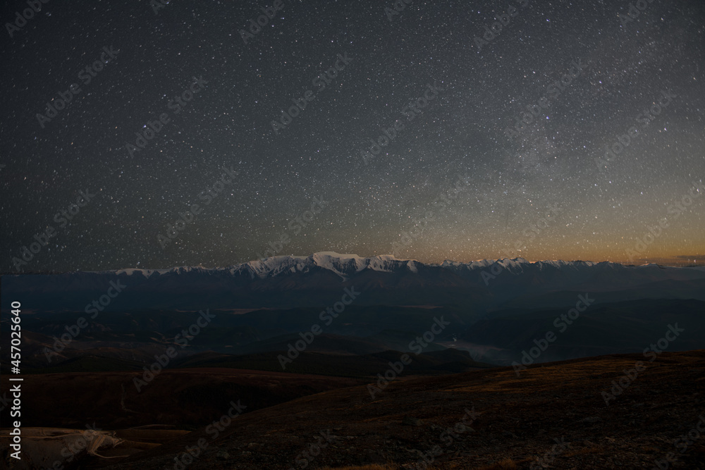 sky with stars over mountains
