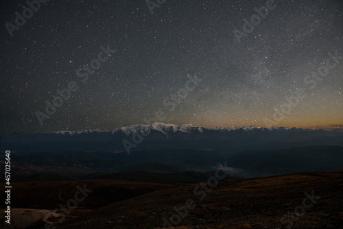 sky with stars over mountains