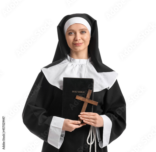 Young nun with Bible on whi...