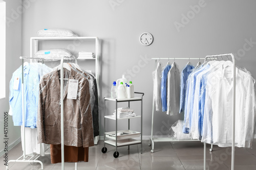 Racks with clothes at moder...