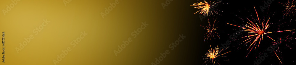 Fireworks banner. Christmas and New Year. Fireworks on black background with color gradient.Salutes on a dark background with copy space. festive Mockup.Winter holidays banner. Fireworks banner. Christmas and New Year. Fireworks on black background with color gradient.Salutes on a dark background with copy space. festive Mockup.Winter holidays banner.
