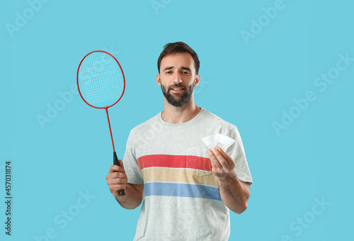 Sporty male badminton playe...