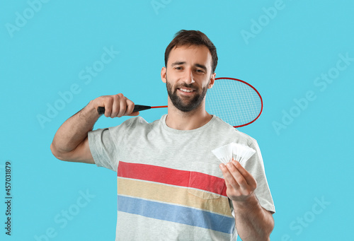 Sporty male badminton playe...