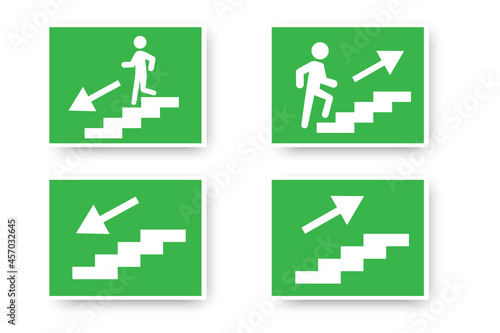 Go up and down stairs icon on green background. Fire safety. Emergency evacuation sign. Vector illustration. Stock image. 