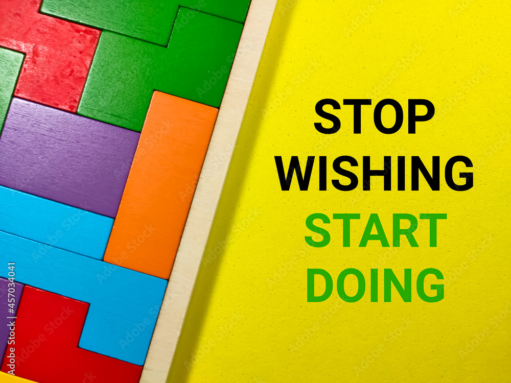 Obraz premium Business concept.Text STOP WISHING START DOING with wooden puzzle on yellow background.