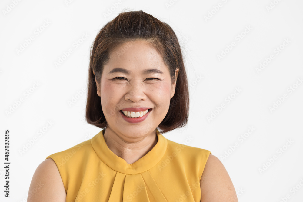 Portrait of middle aged Asian woman wearing yellow blouse smiling beautifully with confident isolated Portrait of middle aged Asian woman wearing yellow blouse smiling beautifully with confident isolated