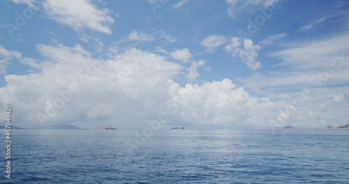 White cloud with blue sky and sea