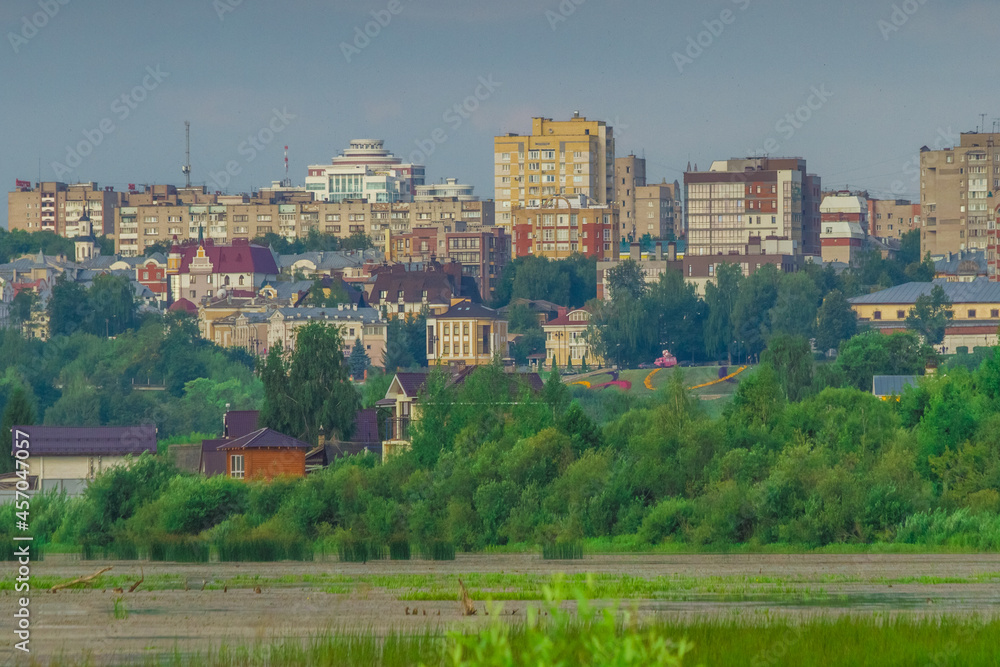 the provincial town stands on a picturesque steep slope of the river on a summer morning