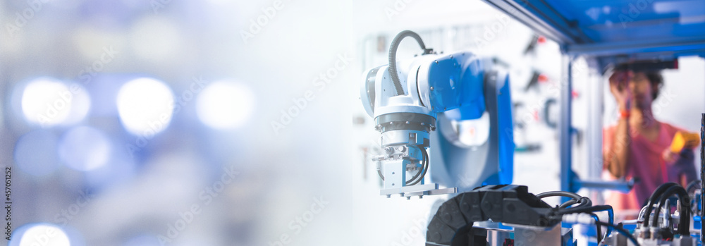 Male Engineers Maintenance Robot Arm at Lab. he are in a High Tech Research Laboratory with Modern Equipment.Professional Japanese Development Engineer is Testing an Artificial Intelligence.start up . Male Engineers Maintenance Robot Arm at Lab. he are in a High Tech Research Laboratory with Modern Equipment.Professional Japanese Development Engineer is Testing an Artificial Intelligence.start up .
