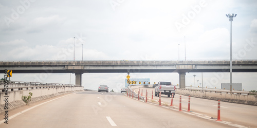 Photography View from the driver while driving the car along to the road at the expressway to escape the traffic jam in the rush hour time