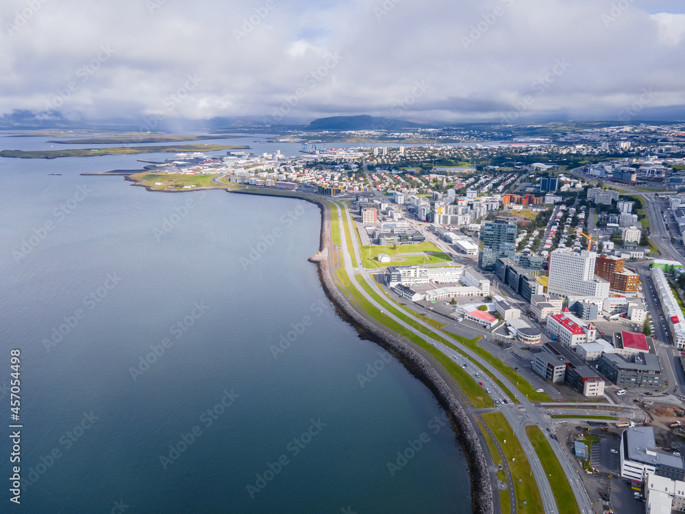 Fototapeta premium Beautiful aerial view of the City of Reykjavik, with its majestic church and colorful houses and streets in Iceland