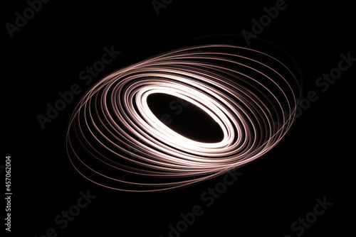 Long exposure of a tiny light swirling over the camera