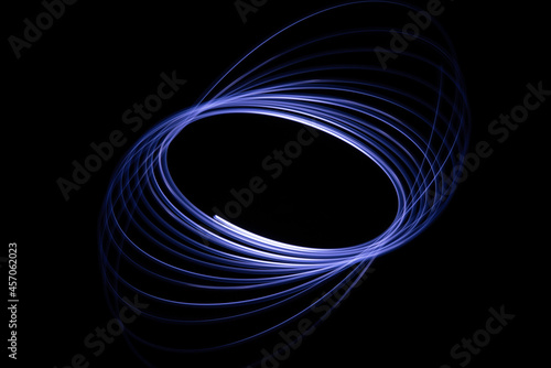 Long exposure of a tiny light swirling over the camera