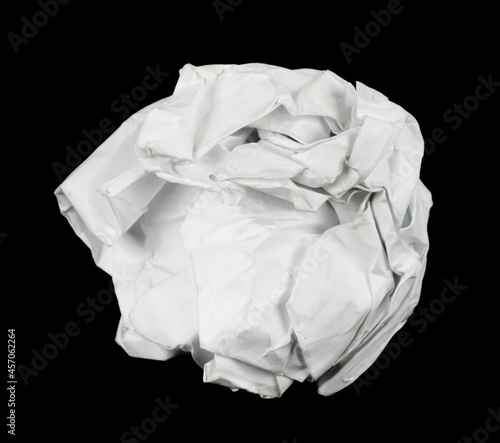 A piece crumpled white paper isolated black background. damaged office paper