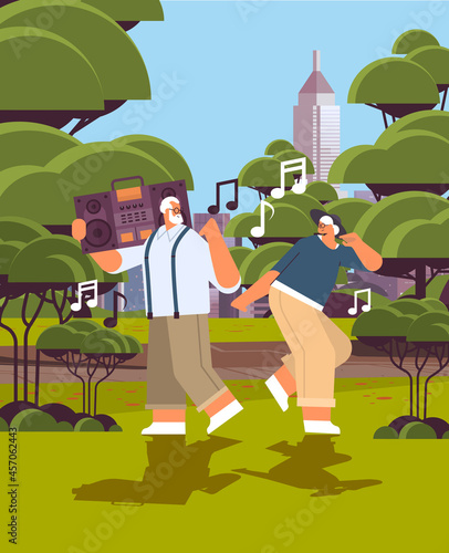 senior family with bass clipping blaster recorder dancing and singing grandparents having fun active old age concept