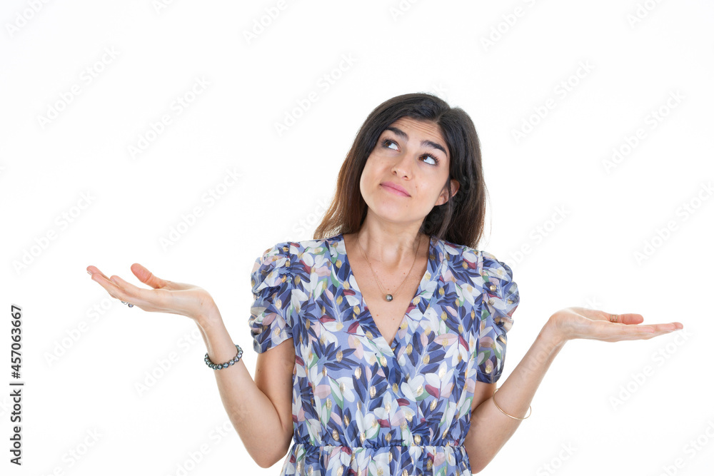 Young woman over isolated white background looking holding copyspace imaginary on two hands palm to insert an product advertising Young woman over isolated white background looking holding copyspace imaginary on two hands palm to insert an product advertising