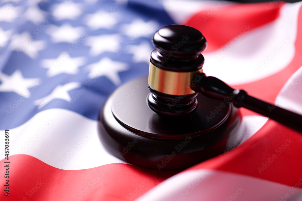 Judge gavel on the flag united states of America. symbol for jurisdiction USA.