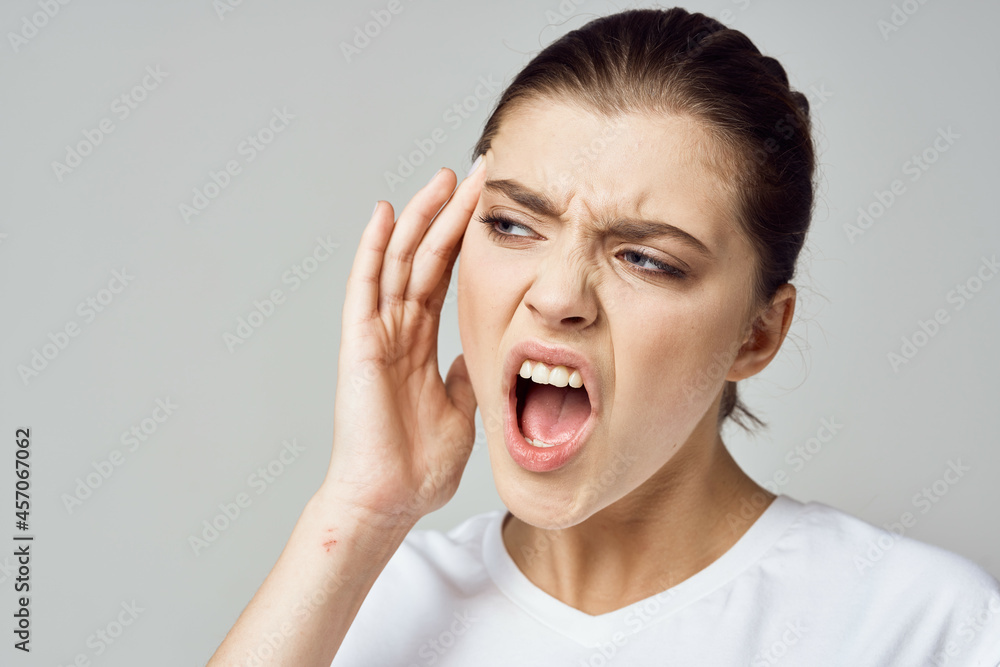 woman in white t-shirt headache migraine depression discontent negative woman in white t-shirt headache migraine depression discontent negative