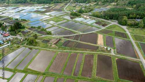 Freshly filled paddy fields on a gentle slope B