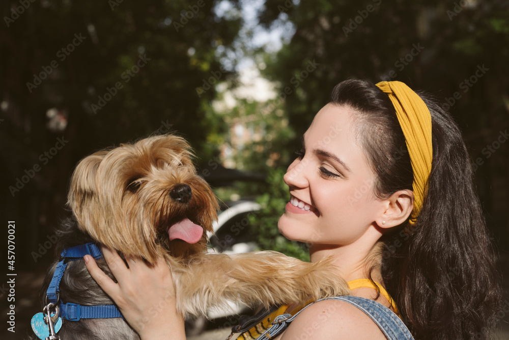 Smiling woman having fun with purebred dog Smiling woman having fun with purebred dog