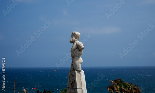 statue of a person in the sea