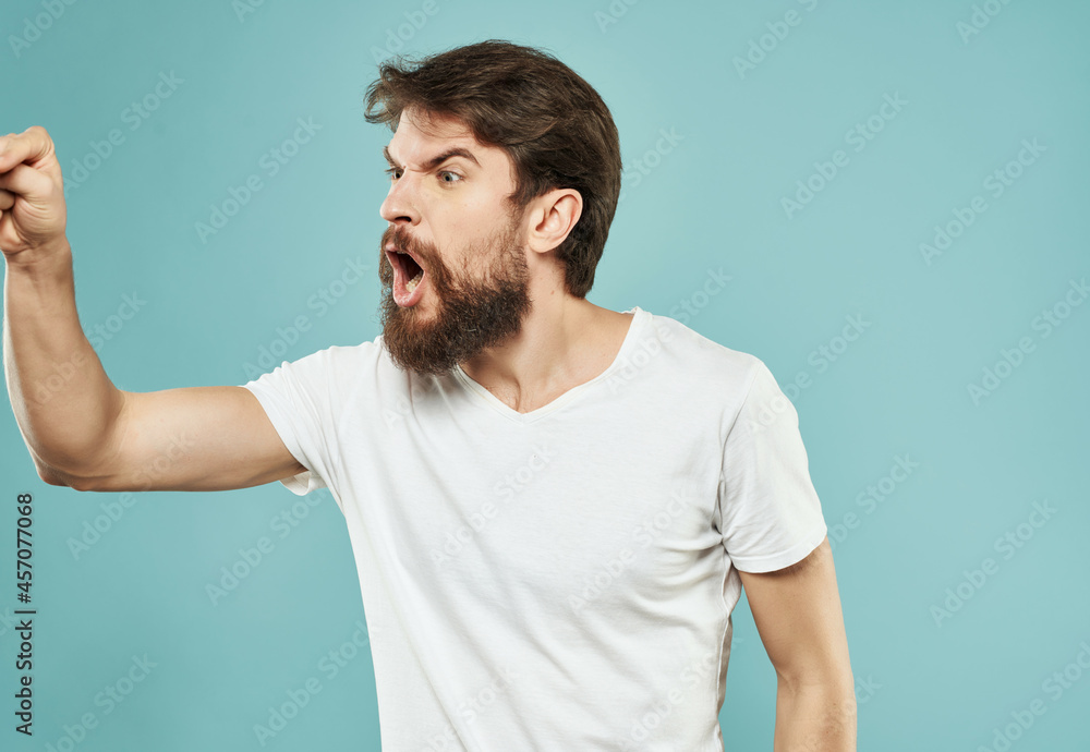 bearded man in a white t-shirt irritated facial expression Studio