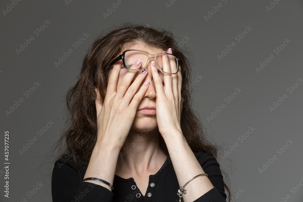 Tired young woman rubbing eyes
Tired young woman rubbing eyes