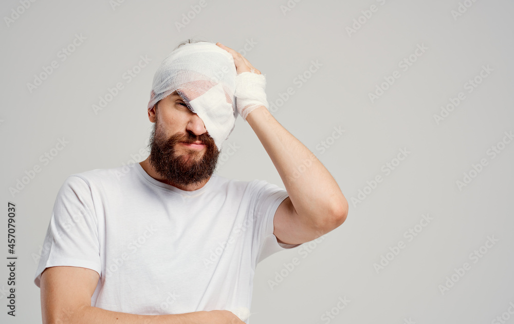 sick man head injury in white t-shirt headache hospital medicine