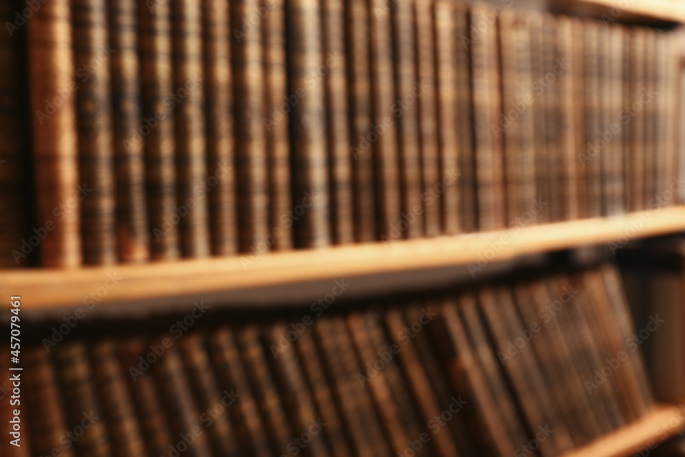 Blurred view of books on shelves in library Blurred view of books on shelves in library