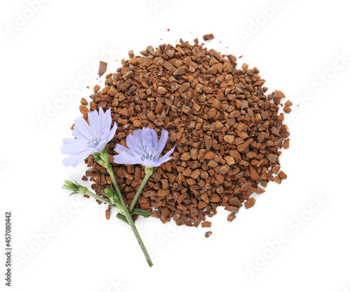 Pile of chicory granules and flowers on white background, top view © New Africa