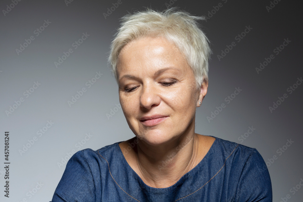 Portrait thoughtful woman with short hair looking down
Portrait thoughtful woman with short hair looking down