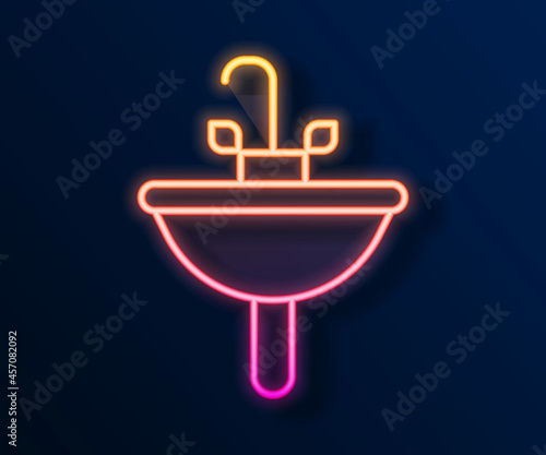 Glowing neon line Washbasin with water tap icon isolated on black background. Vector