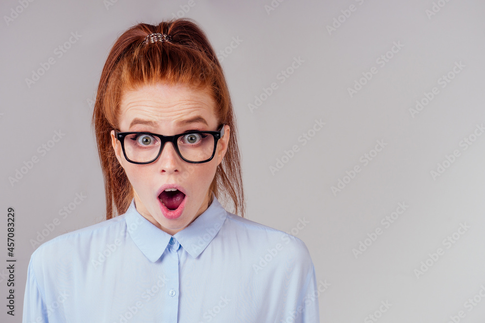 amazed redhair ginger woman worried, fear expression in studio background