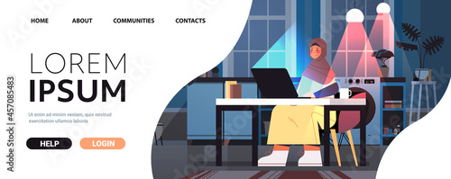 arab businesswoman freelancer working on laptop arabic woman sitting at workplace in dark night home room