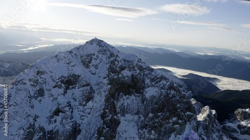 Aerial shot of mountain Triglav with snow on top