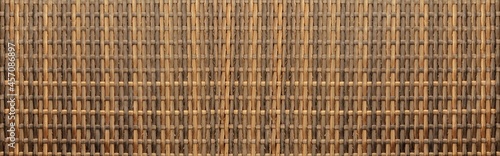 Panorama of Brown rattan wooden table top pattern and background seamless