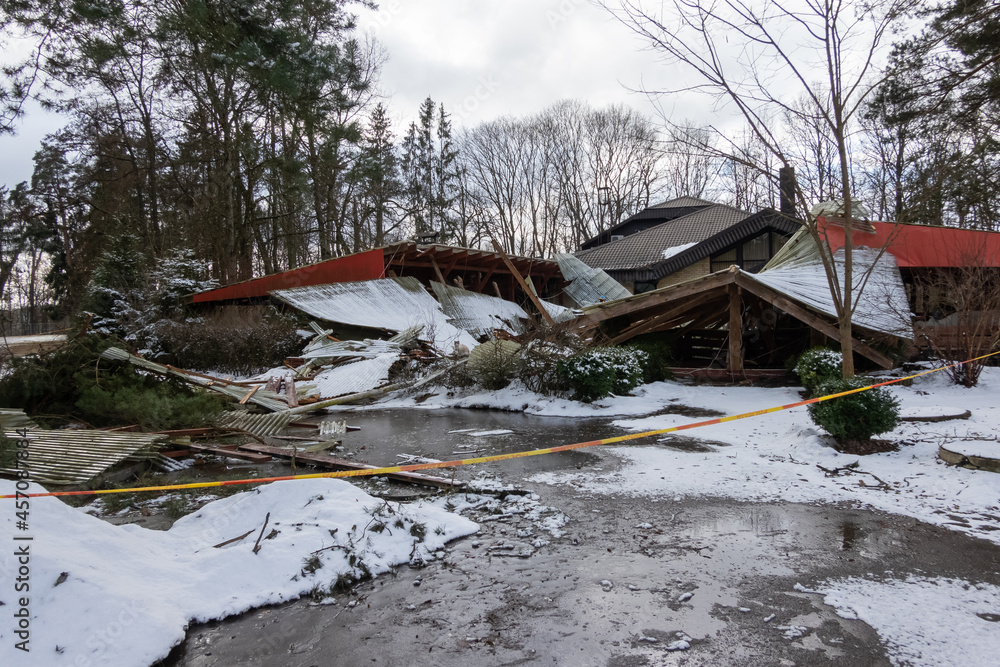 Collapsed roof of an old wooden building. Abandoned architecture, ruins in the countryside. Collapsed roof of an old wooden building. Abandoned architecture, ruins in the countryside.