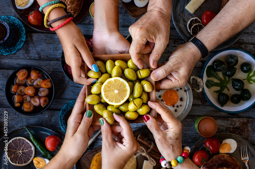 Tableau sur toile Close up view of breakfast table with green olives