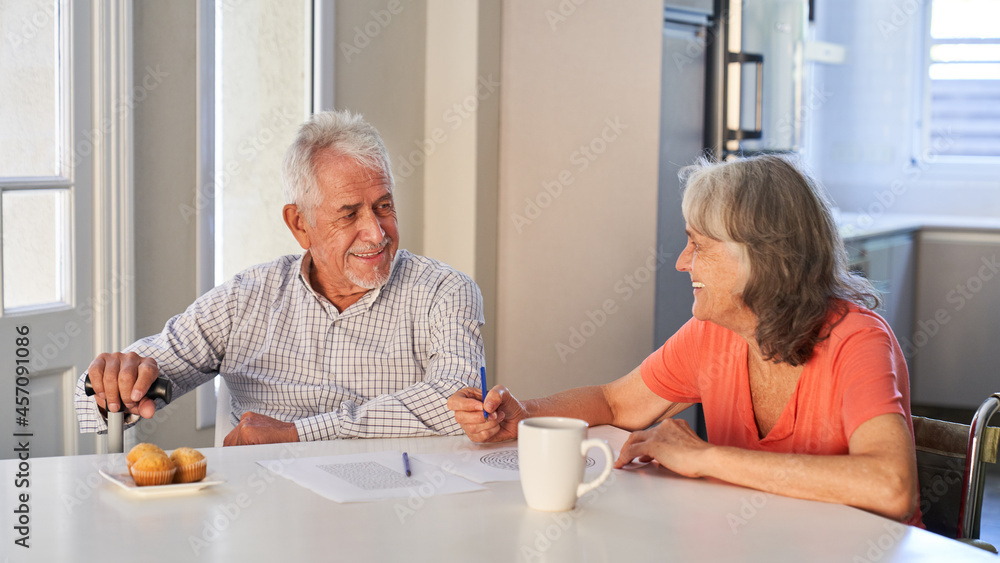 Happy senior retired couple doing memory training Happy senior retired couple doing memory training