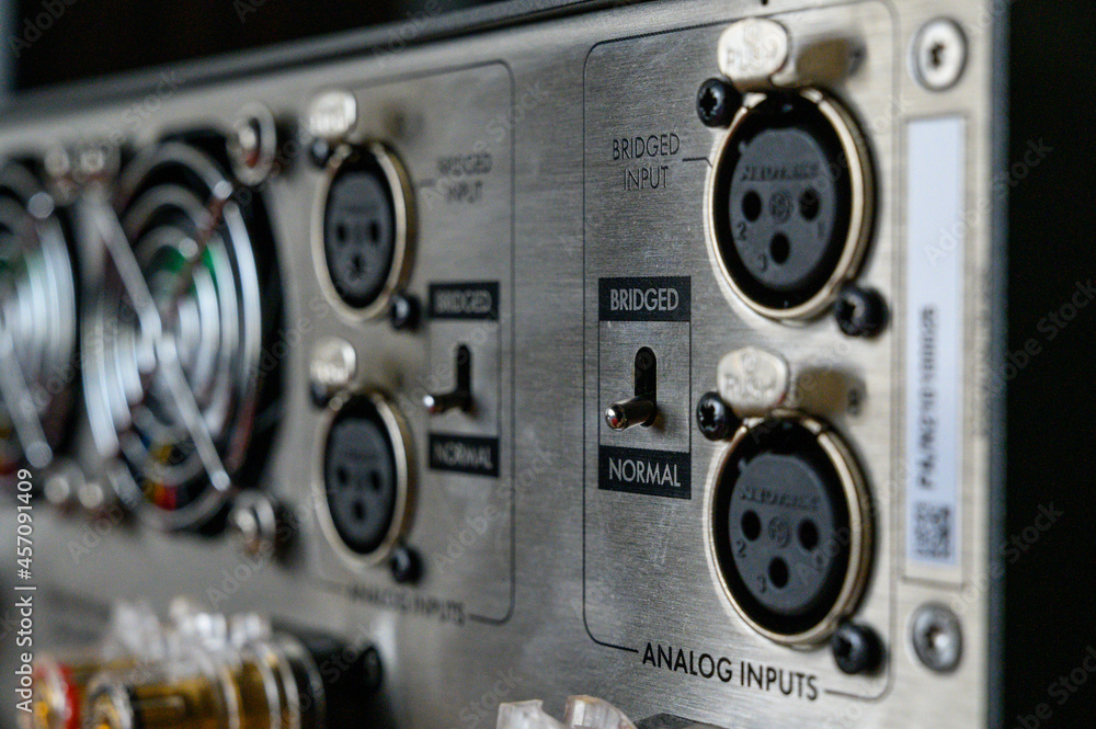 rear panel of the stereo amplifier. Audio electronics, connectors for cable connections. Mode switch. listen to good music, beautiful sound. Shallow depth of field, bokeh.