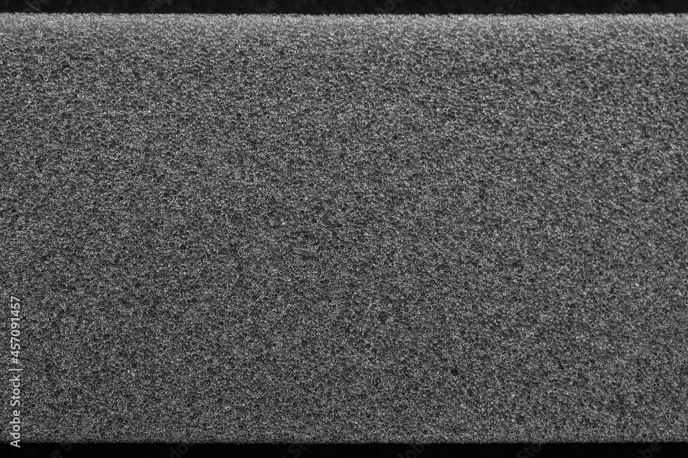 Fototapeta premium Acoustic foam rubber. Fine grained gray texture. Background for the design of the site, booklet, album. Emptiness and silence, the soft wall of the cinema. The stereo system is playing. 